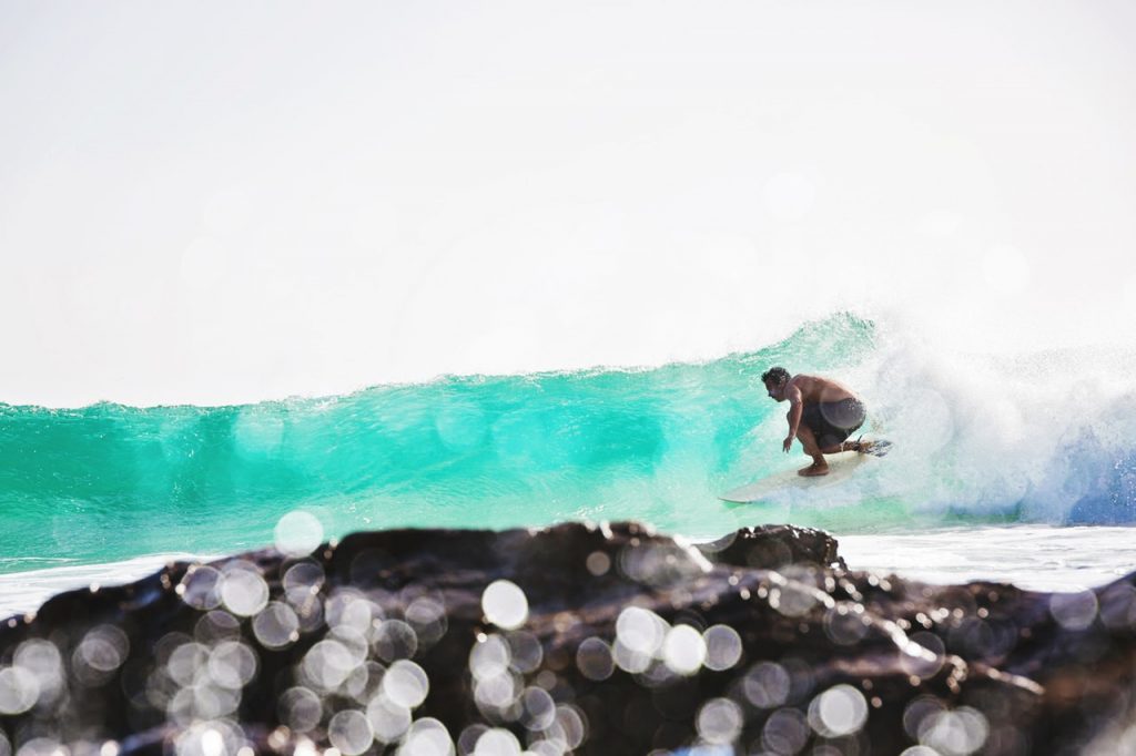 man surfing on wave